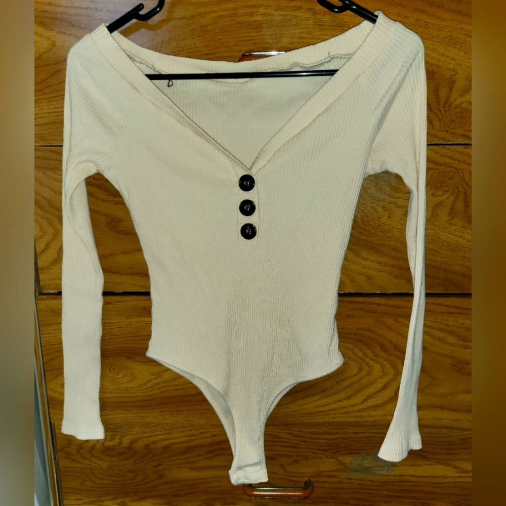 Never been worn Beige/Cream body suit